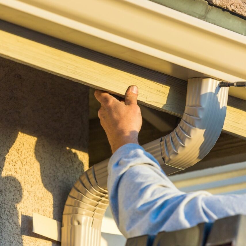 Fall cleaning the gutters 